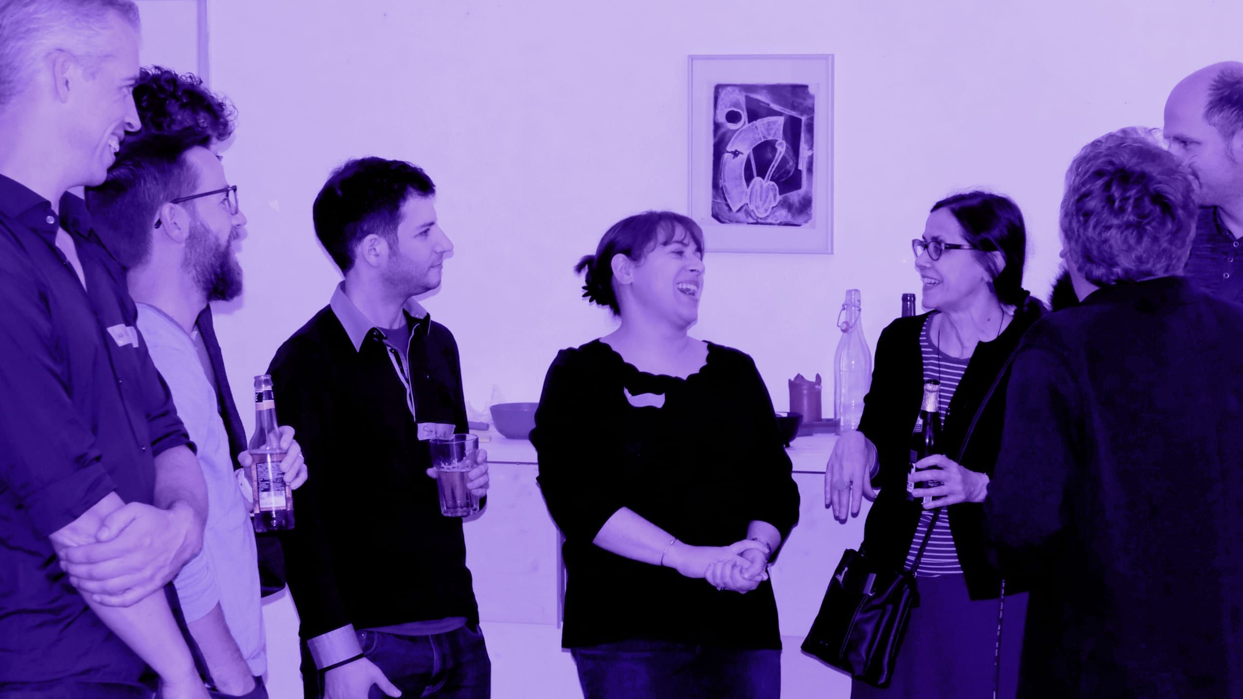 Listeners chatting over drinks and beers at a Data Stories meetup