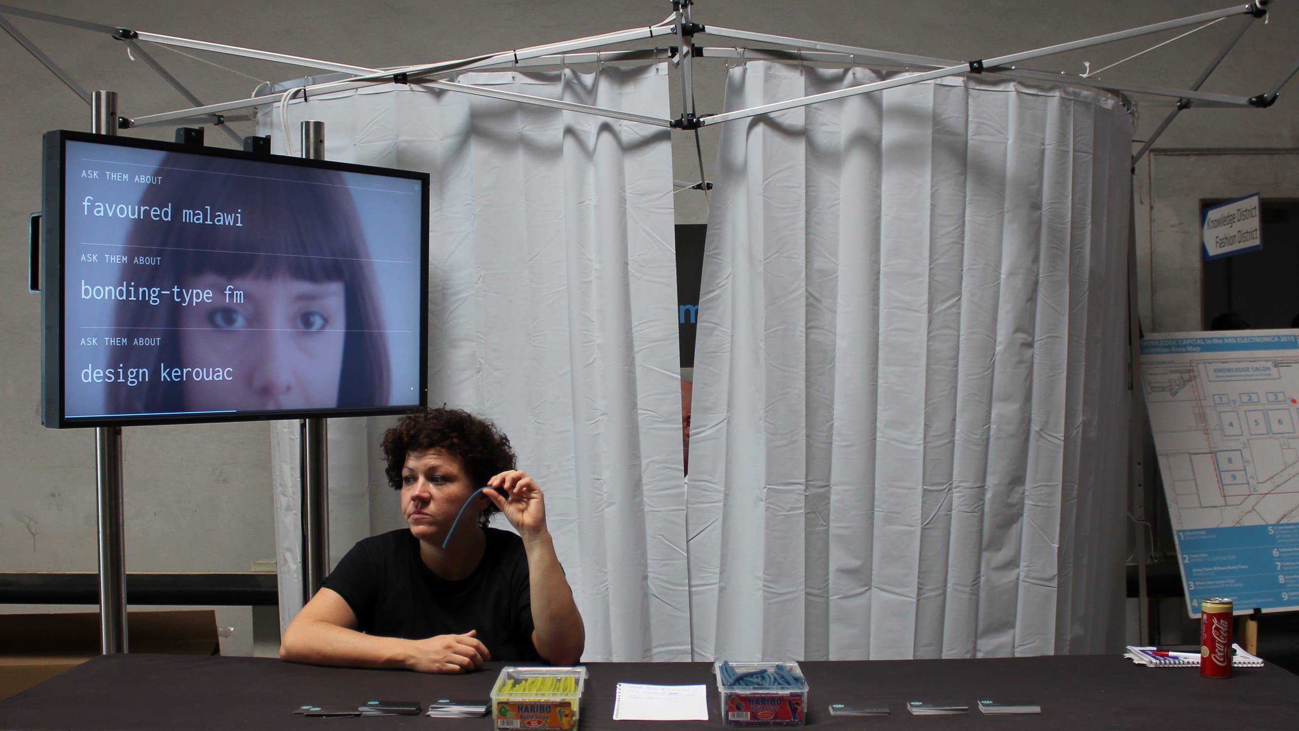 Candygram staffer beside a screen listing speculative profile keywords about a visitor