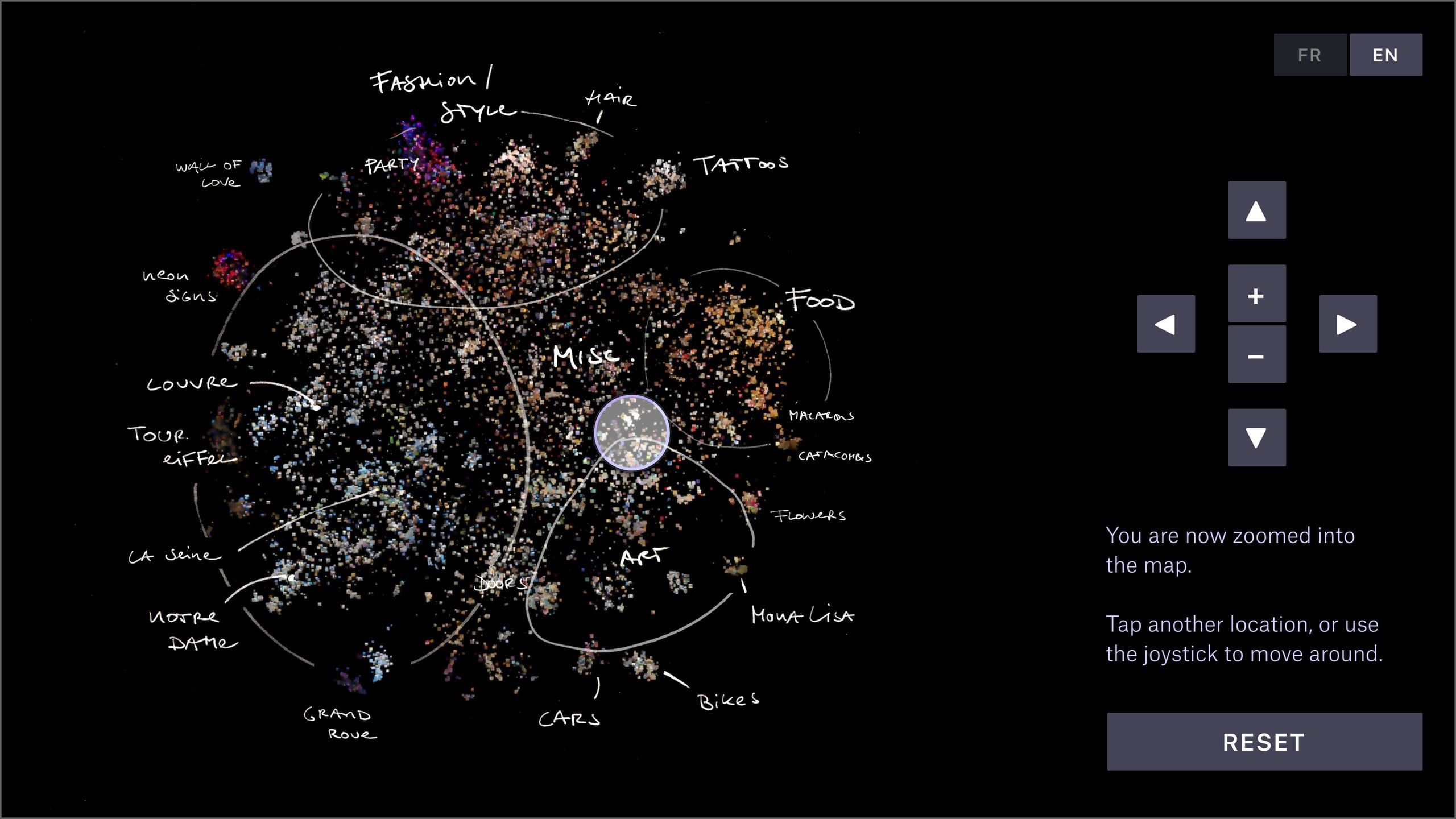Touchscreen interface showing the annotated overview map with handwritten cluster labels and joystick navigation controls