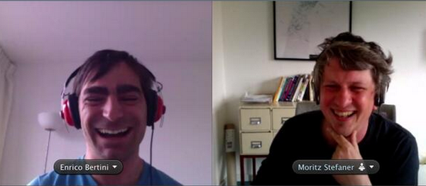 Co-hosts Enrico Bertini and Moritz Stefaner laughing together during a video-call recording