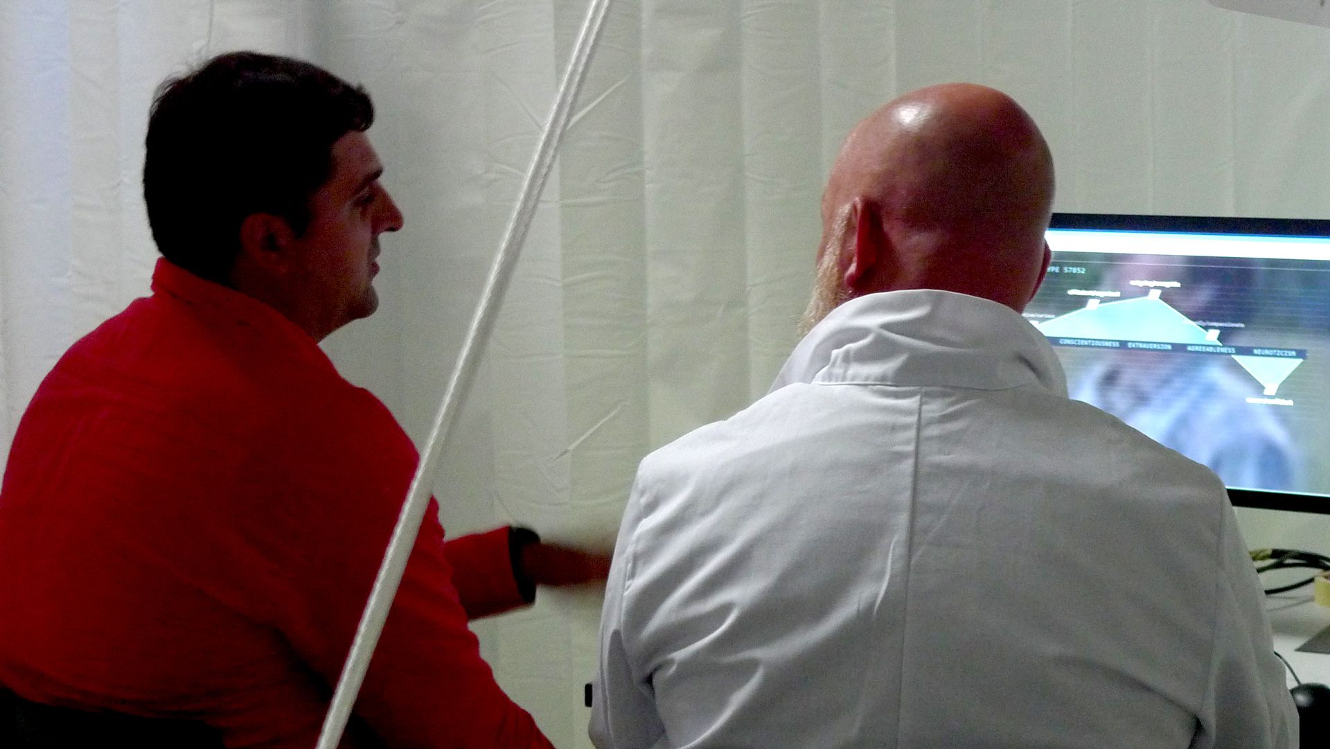 Participant and staffer viewing a Big Five personality profile screen during a personal consultation